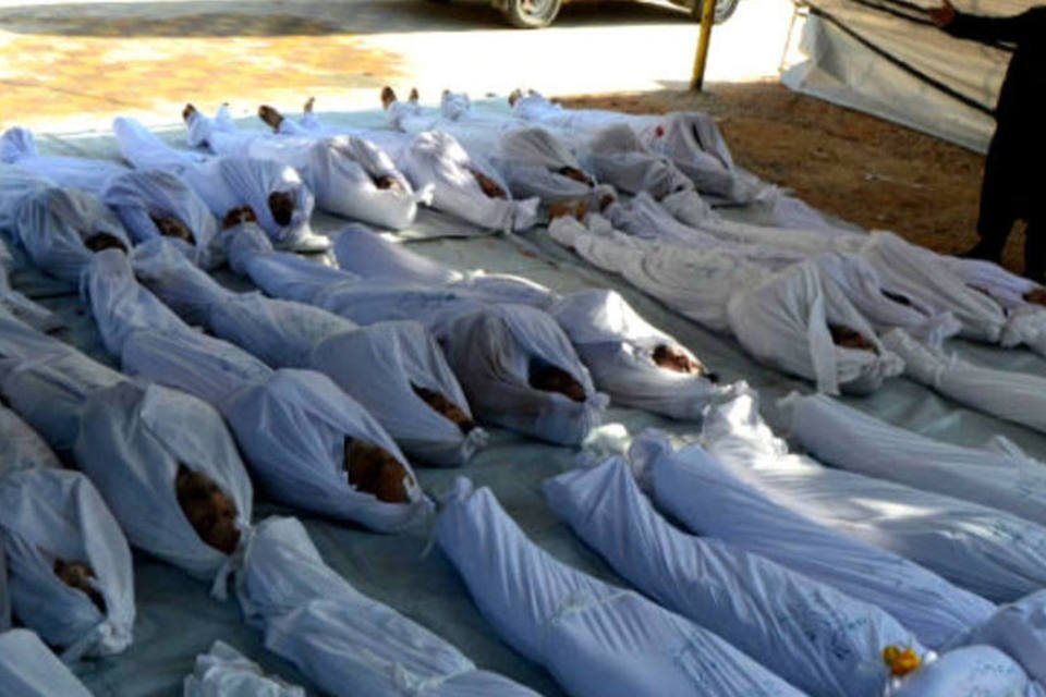 Relatório acusa regime sírio de massacre; veja fotos