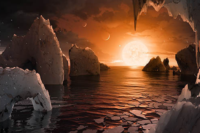 Ilustração de como pode ser um dos planetas recém-descobertos pela Nasa orbitando a estrela Trappist-1