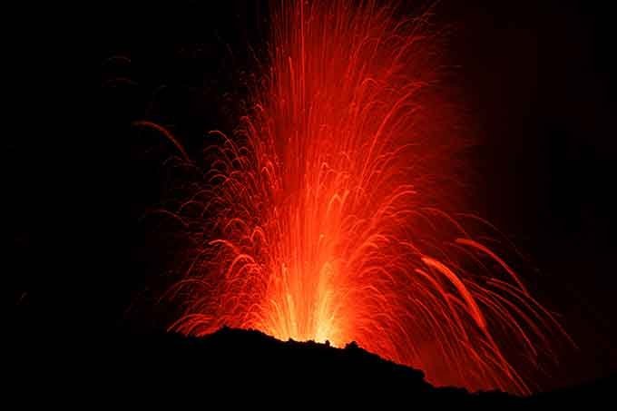 Italy's Mount Etna, Europe's tallest and most active volcano, spews lava as it erupts on the southern island of Sicily