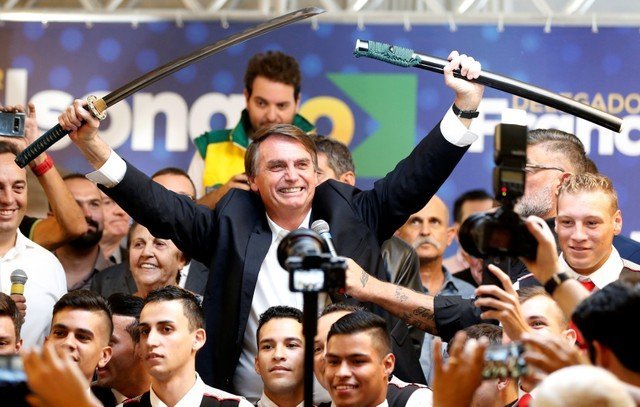 Federal deputy Jair Bolsonaro, a pre-candidate for Brazil&#8217;s presidential elections, shows a sword during a rally in Curitiba
