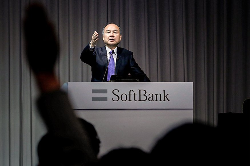 A journalist raises her hand to ask a question to Japan’s SoftBank Group Corp Chief Executive Masayoshi Son during a news conference in Tokyo